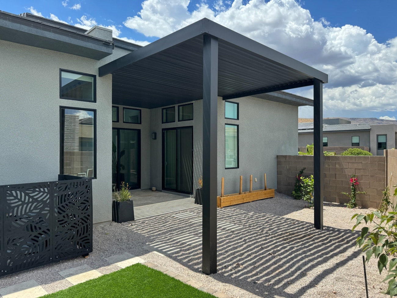 Premium black 4K patio cover with luxury finishes and aluminum fencing for Las Vegas residence