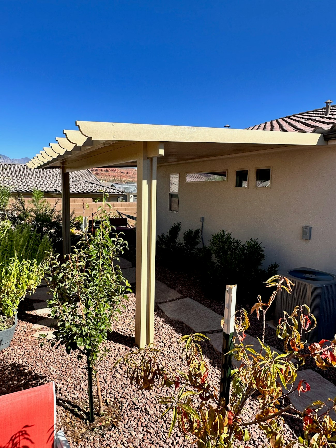 Tan solid aluminum patio cover with corbel rafter tails upgraded on Phoenix, Arizona home