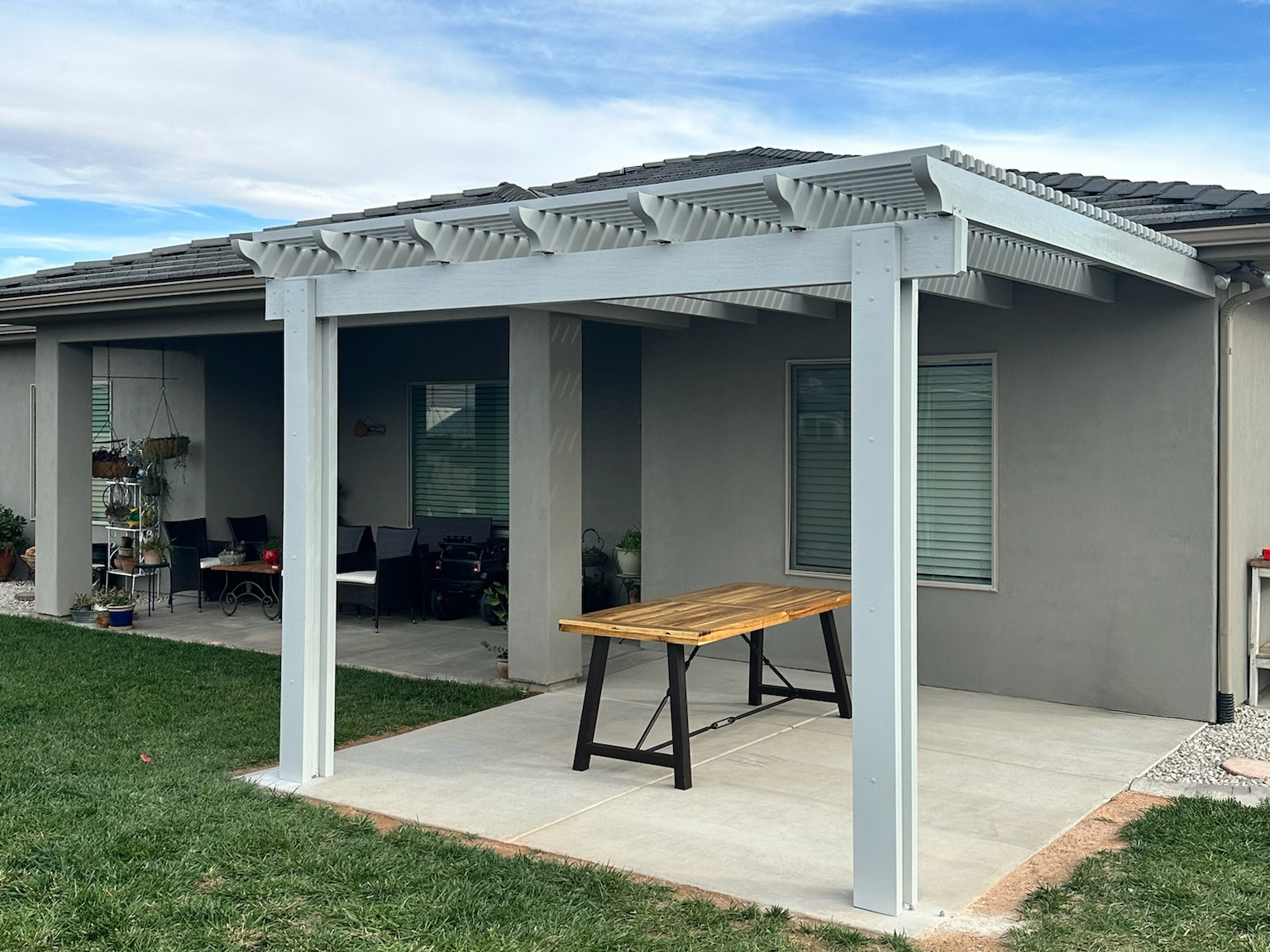 Lattice aluminum awning in white over back patio in Phoenix, Arizona home