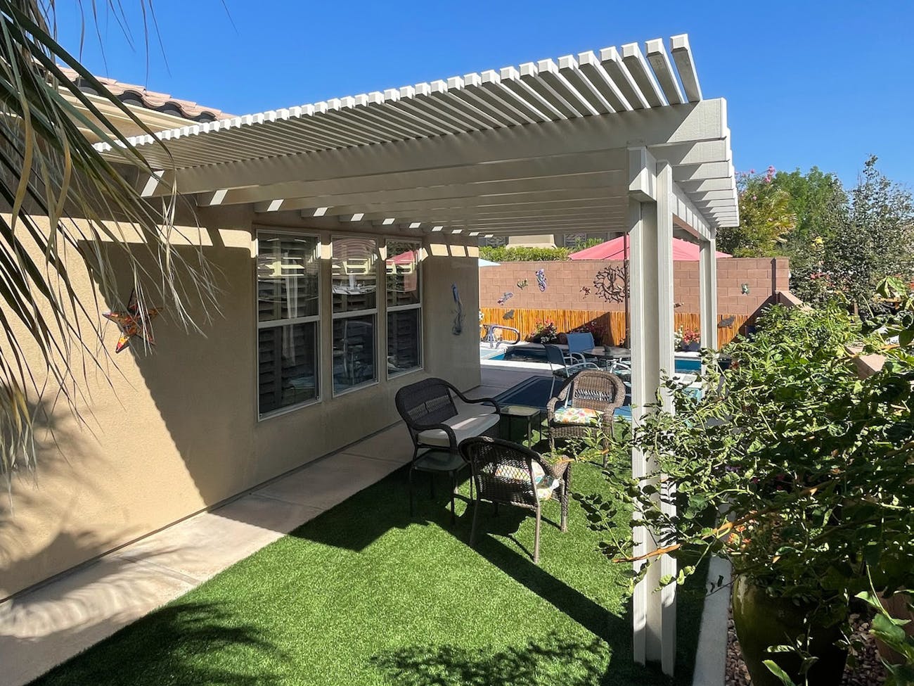 Decorative white lattice awning enhancing outdoor space in Tempe, Arizona