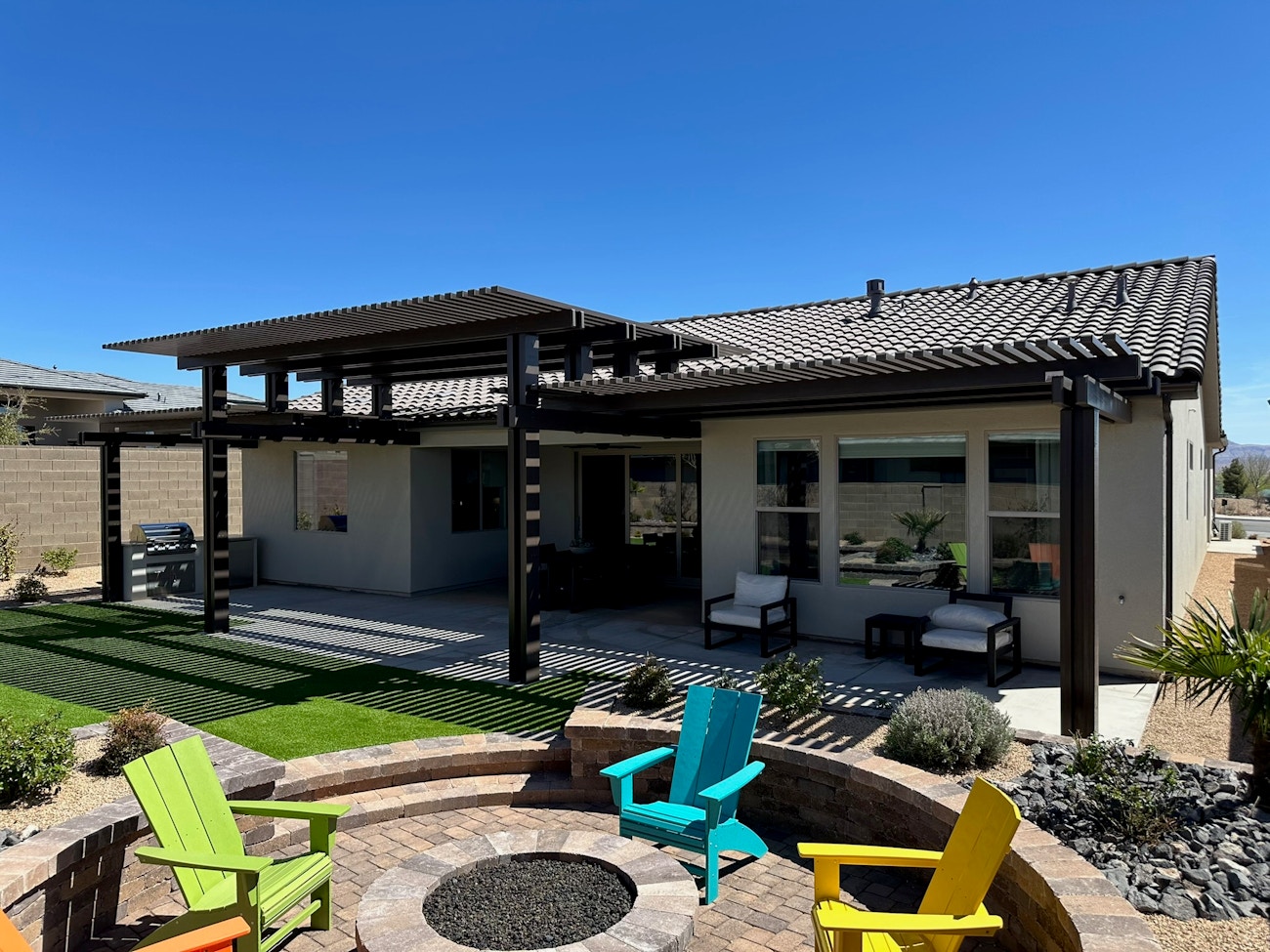 Three brown aluminum patio covers providing filtered shade from Phoenix, Arizona sun