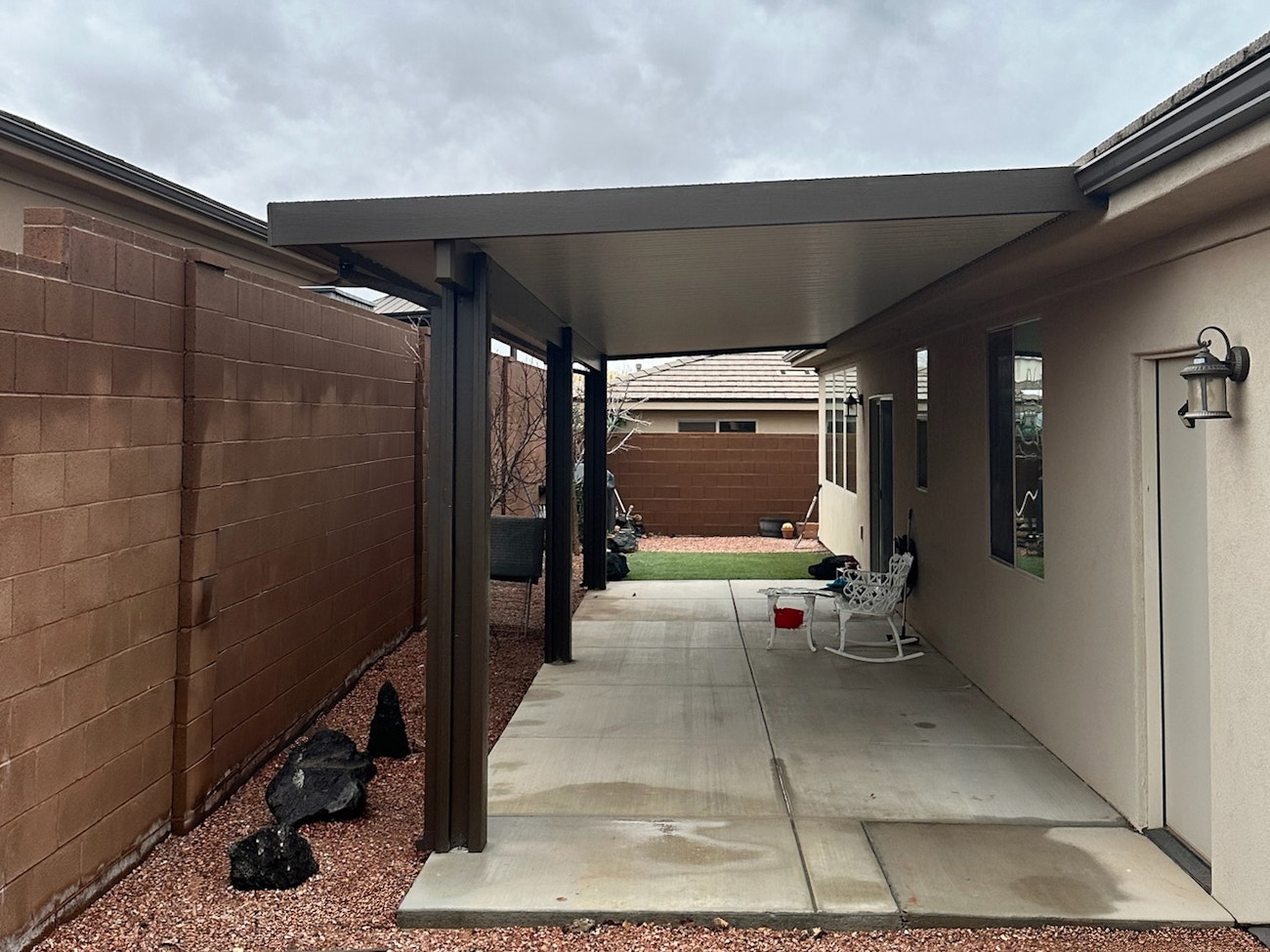 Energy-efficient insulated awning in brown and white installed in Phoenix, AZ