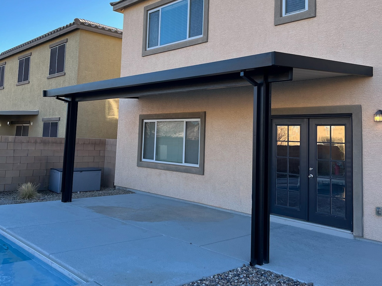 Simple black insulated patio cover for back patio in Phoenix, Arizona
