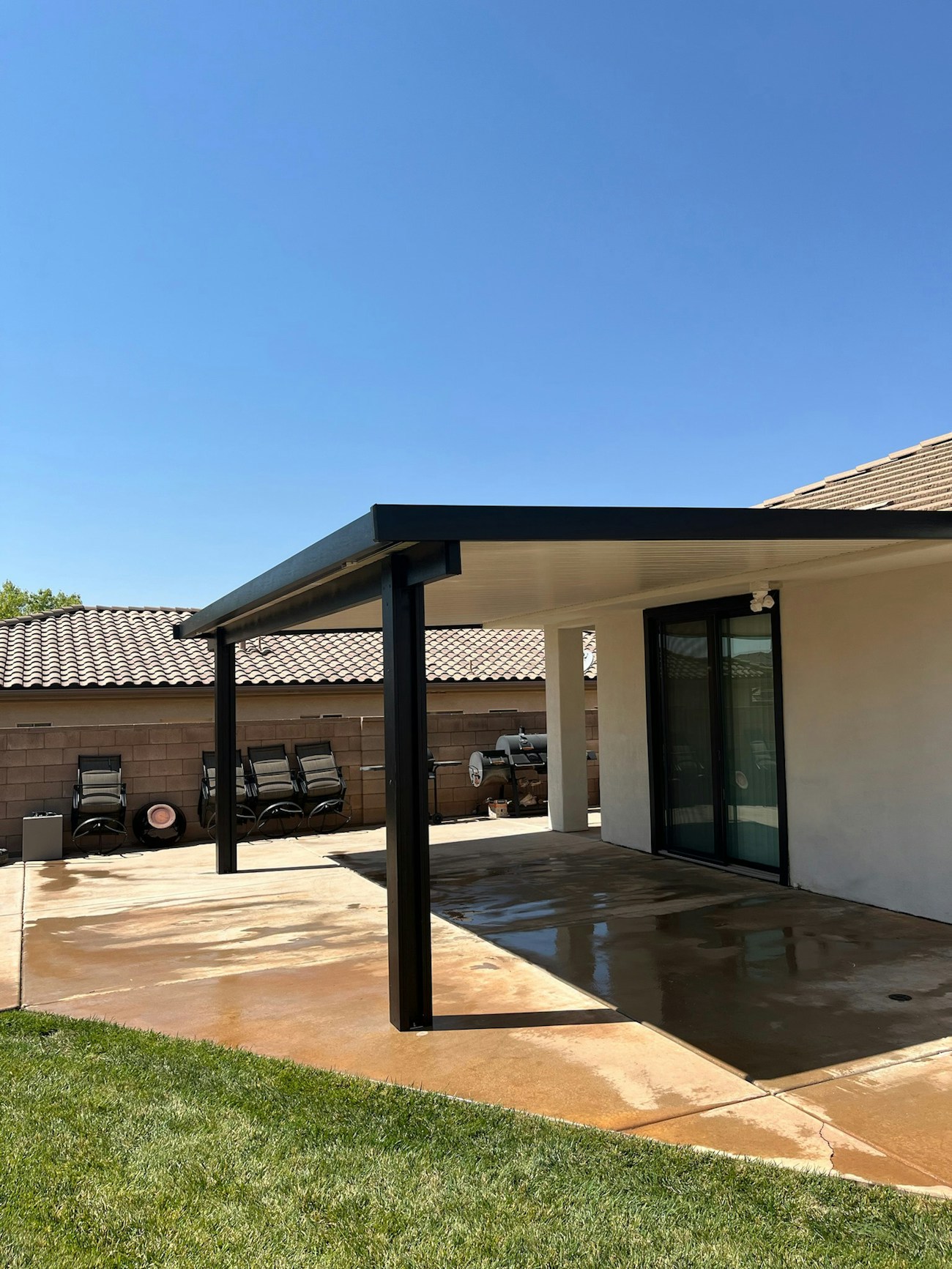 Full coverage aluminum awning in black installed in St. George, Utah home