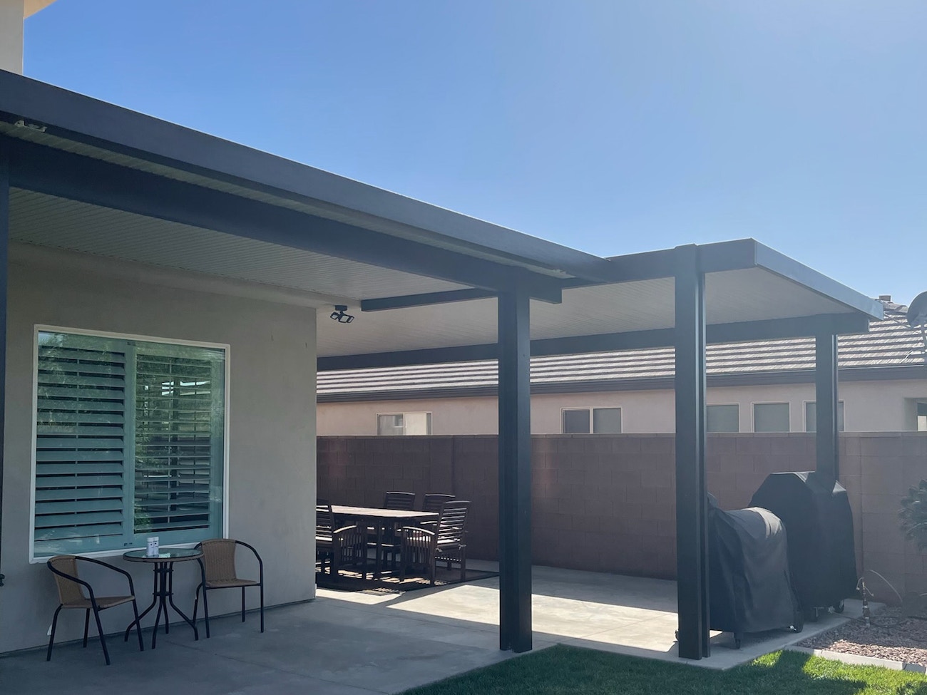 Tall aluminum patio cover awning with white ceiling located in St. George, Utah