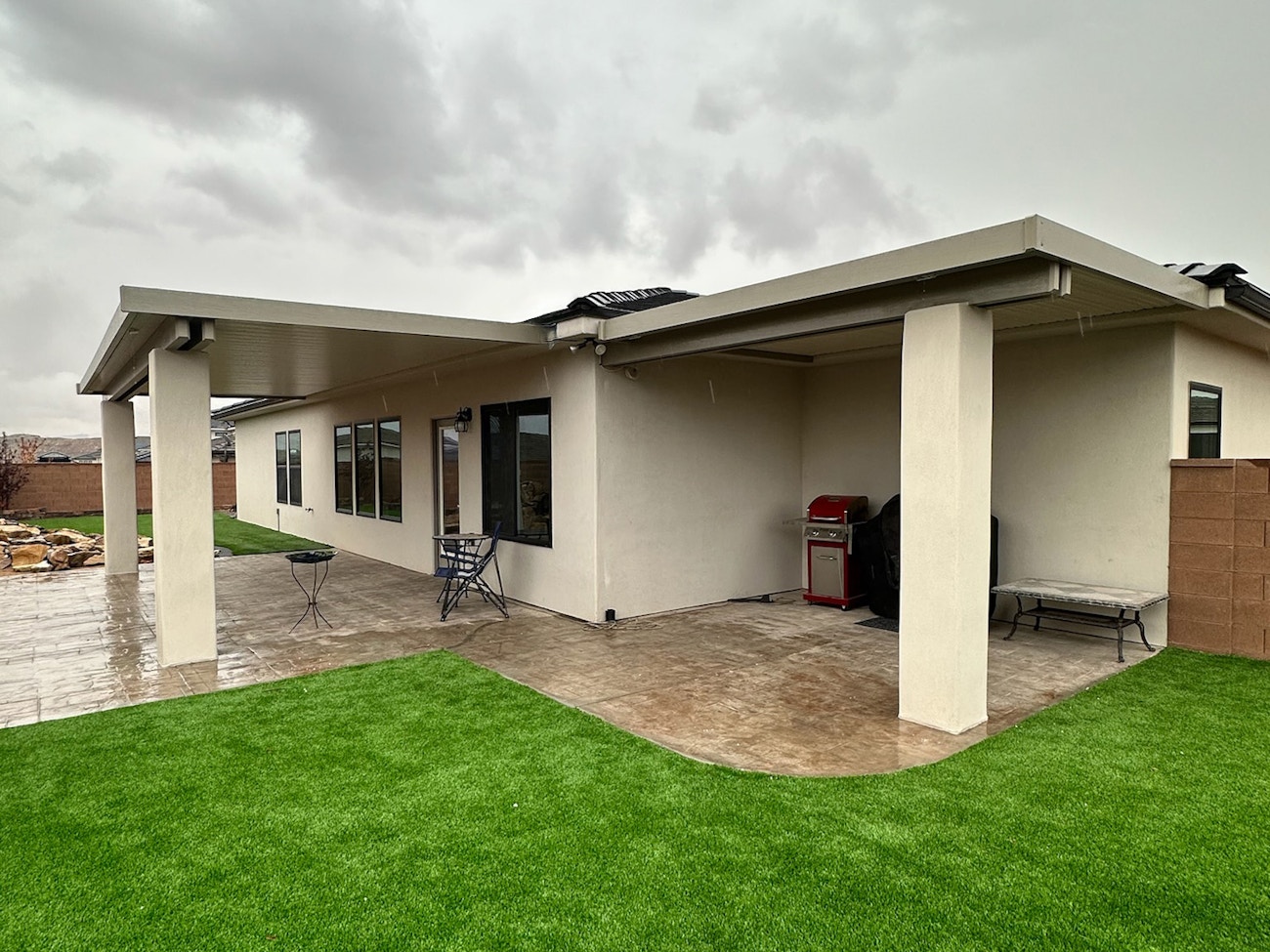 Two aluminum awnings with custom stucco columns for each in Saint George, Utah