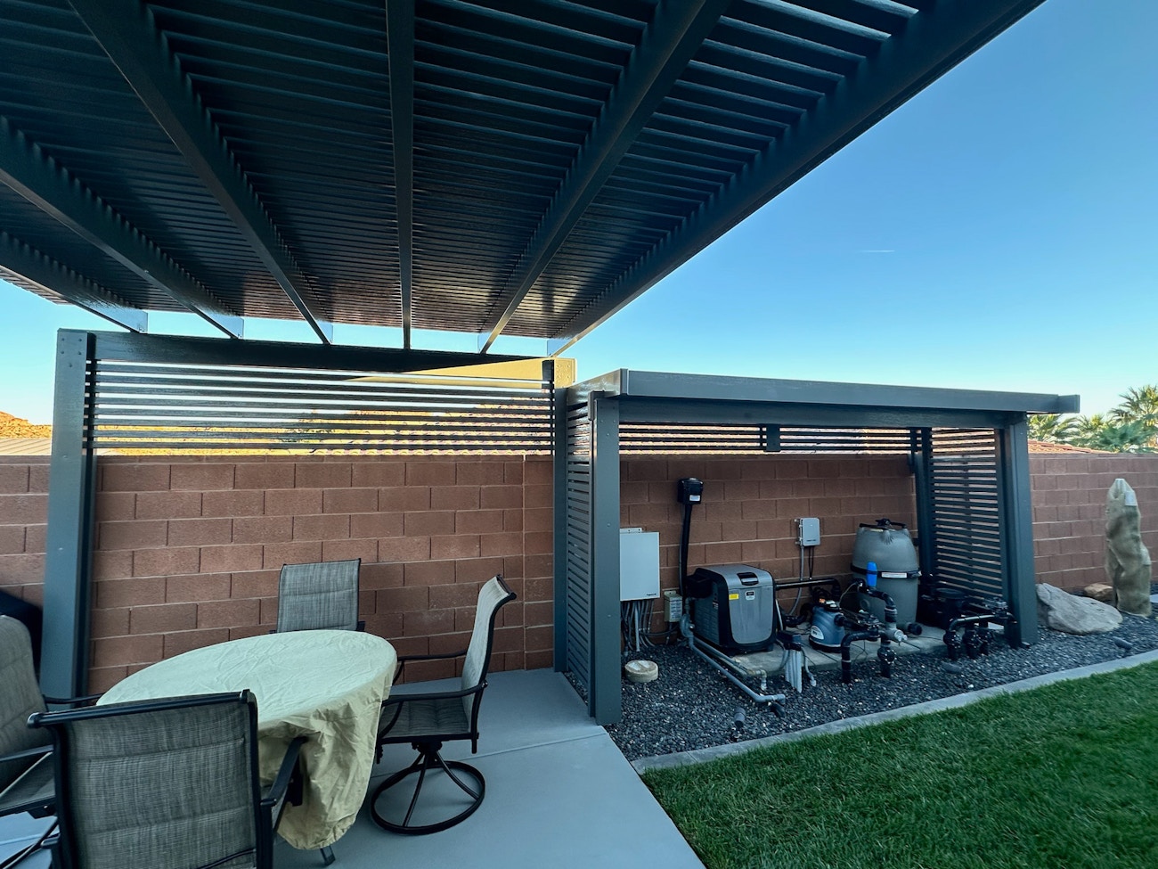 Free standing lattice patio cover with privacy wall over Saint George pool equipment