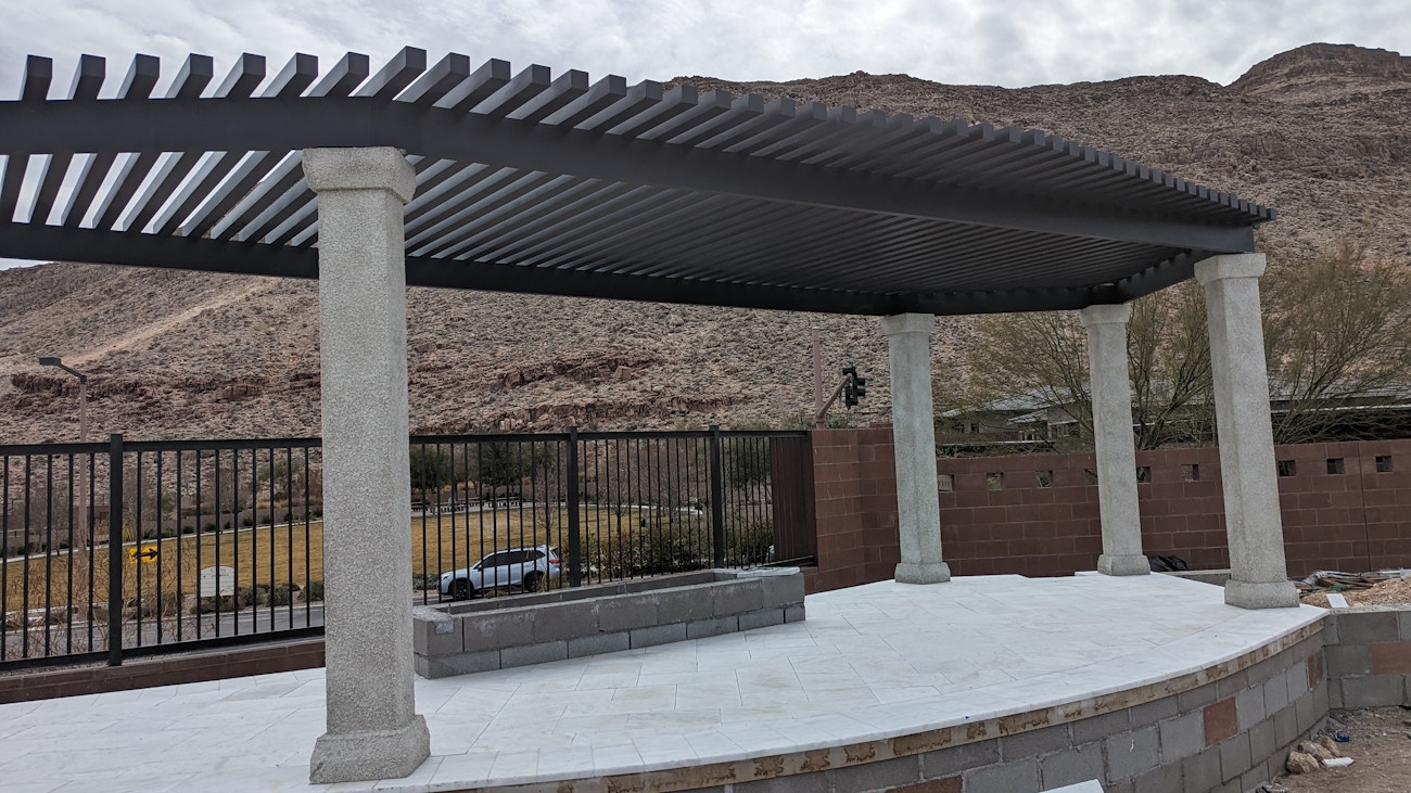 Designer 4K aluminum lattice awning in brown with stucco columns for upscale Washington, Utah backyard