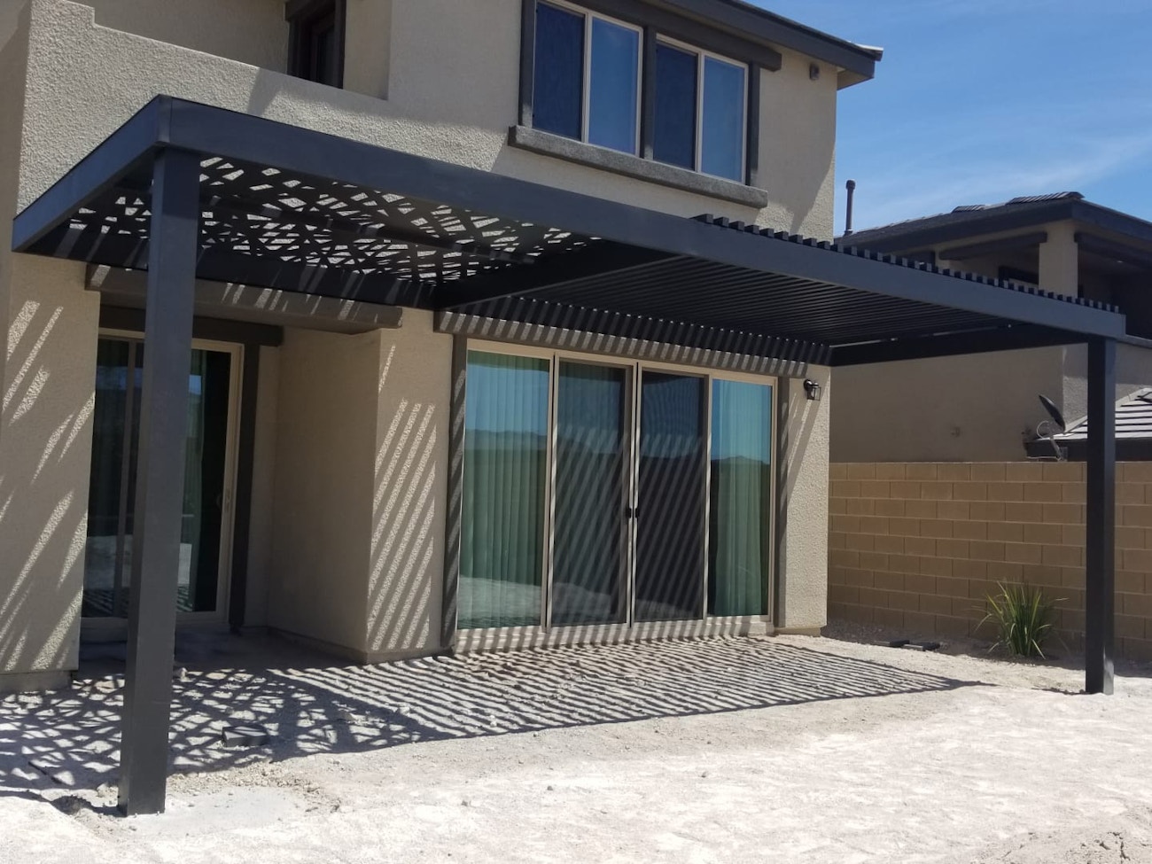 Custom 4K aluminum awning attached to Mesquite, Nevada home with custom roof panel