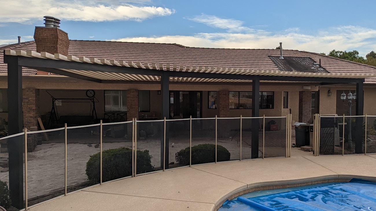 Two-tone designer 4K aluminum awning with lattice top for backyard located in Saint George