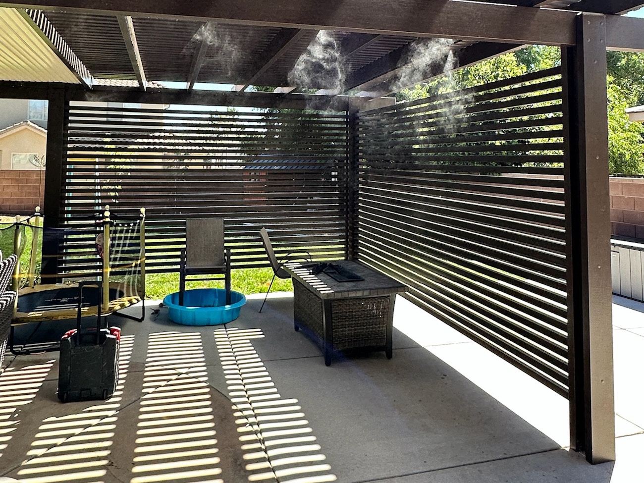 Patio cover with dual lattice privacy wall for privacy and extra shade