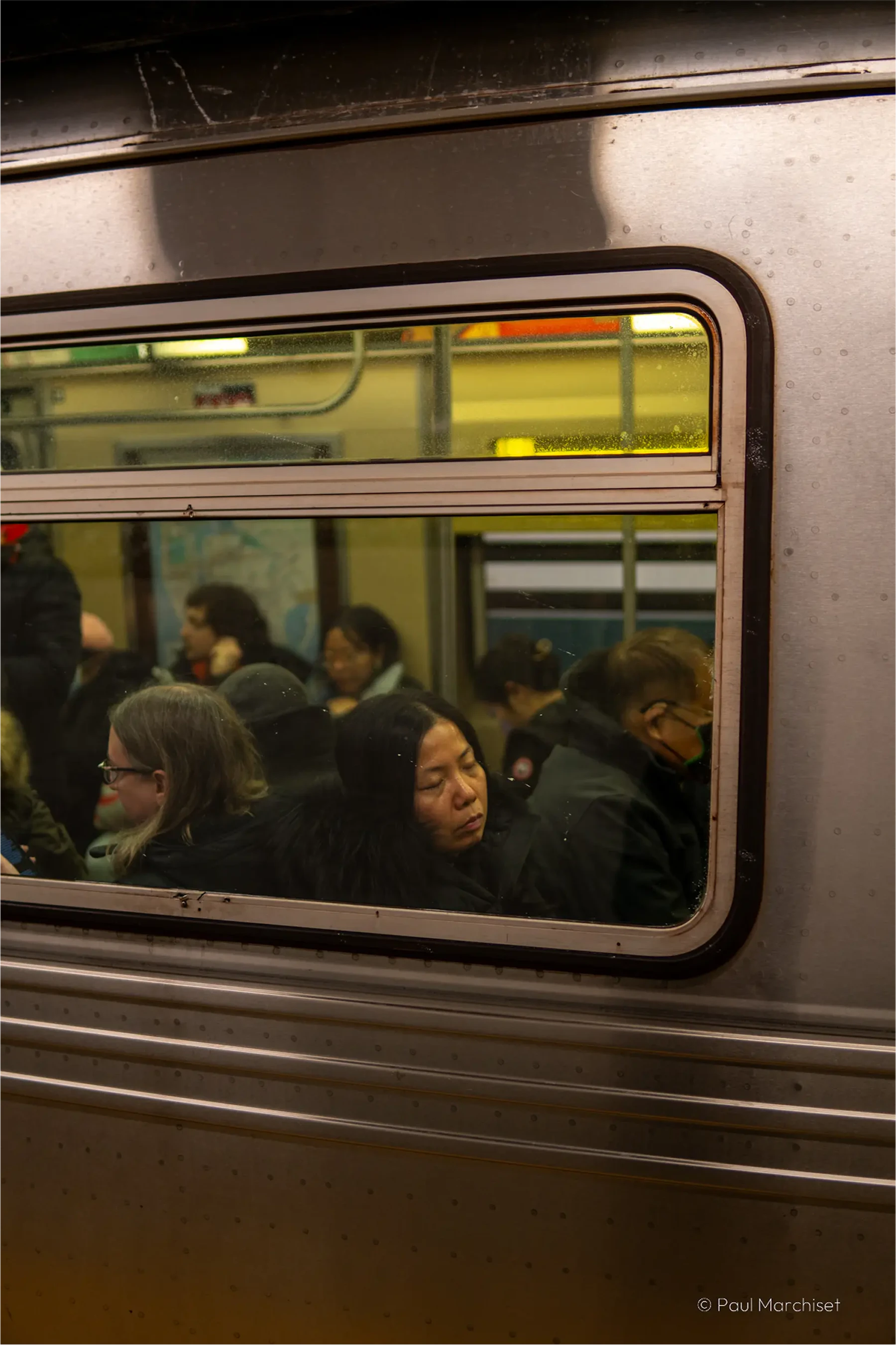 woman sleeping in the subway