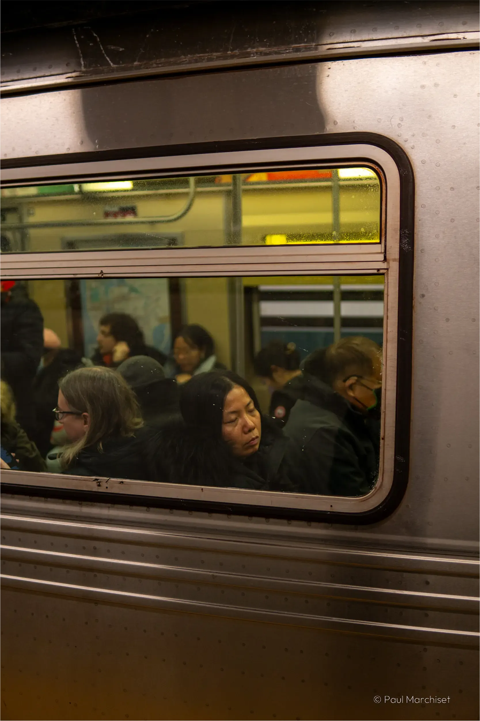 woman sleeping in the subway