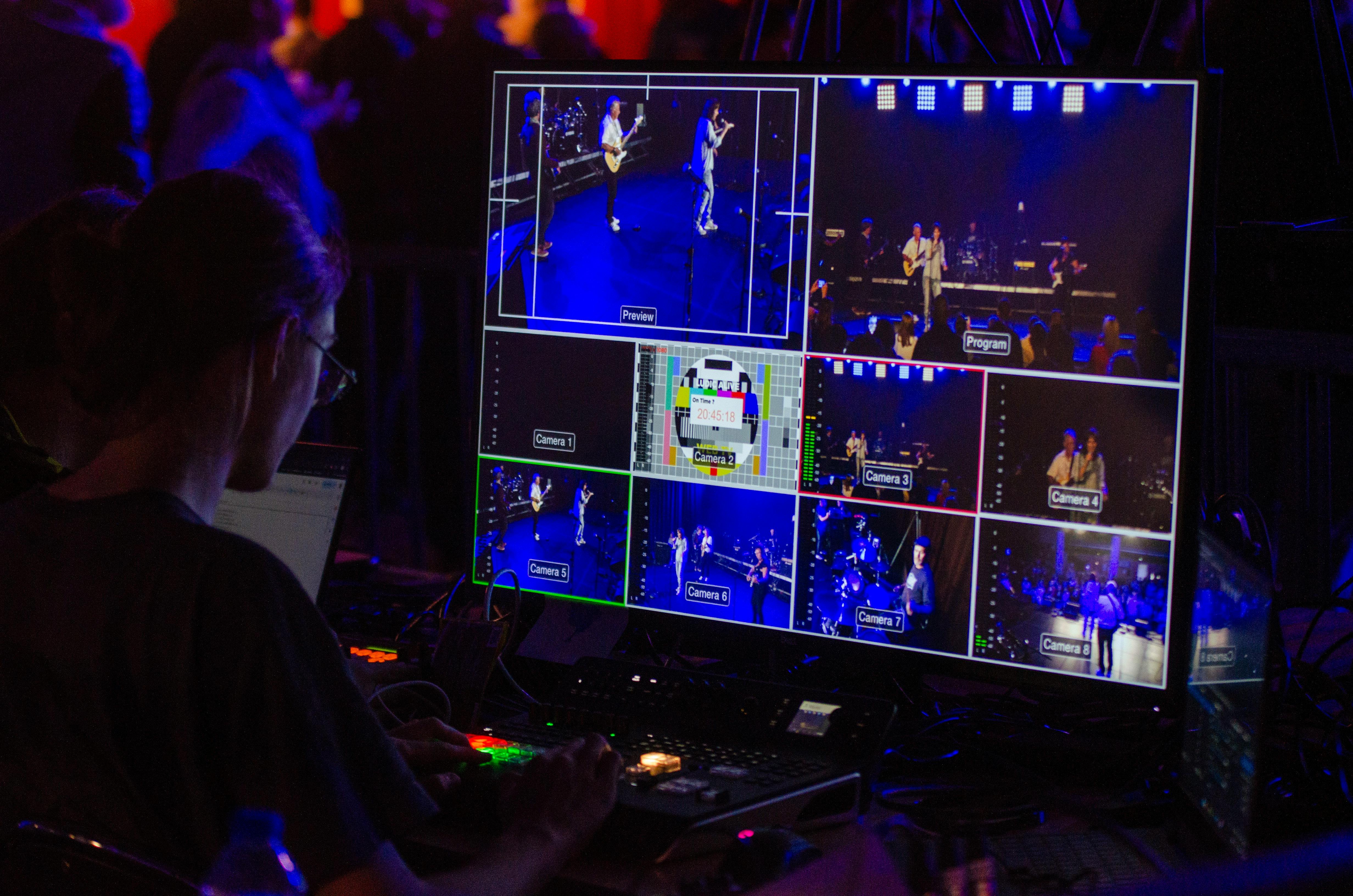 tv with a producing mixer with someone looking at