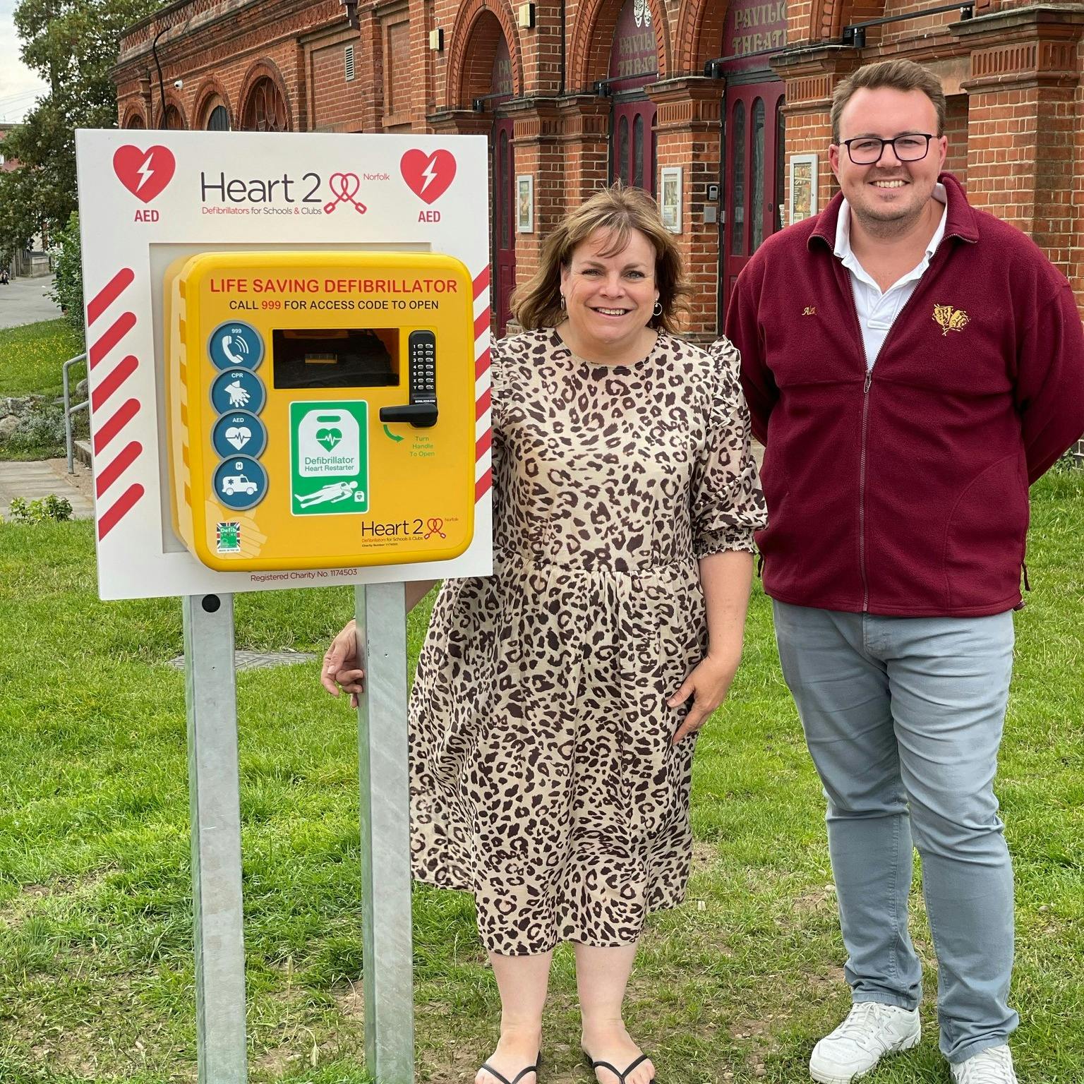 Jayne Biggs of Heart2Heart Norfolk and Alex Youngs Chair of Trustees of the Pavilion with the new defibrillator