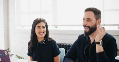 A man and a woman in a work setting.