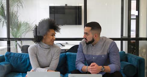 Two people in an office setting.