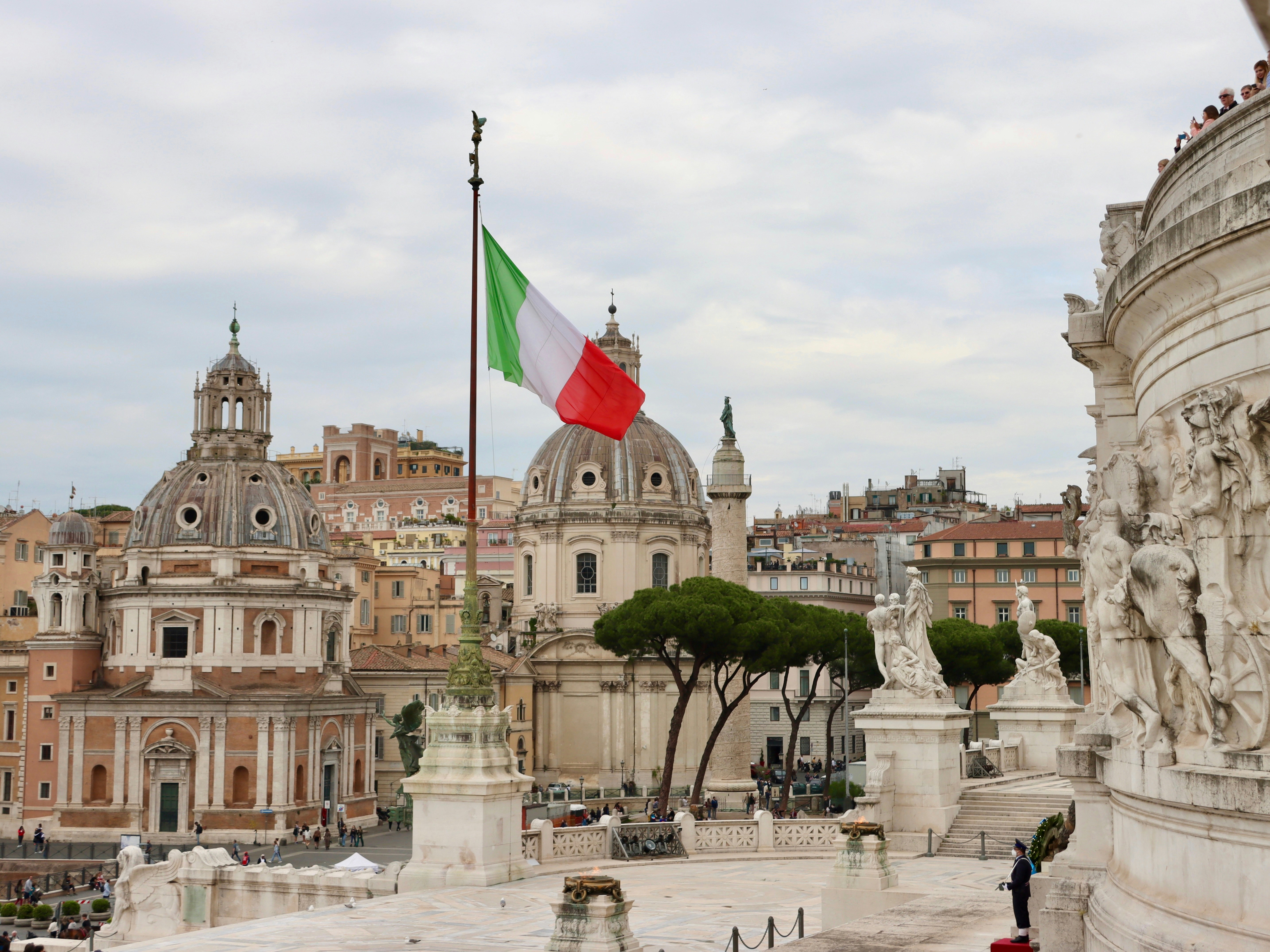 View of an Italian flag over the city of Rome.