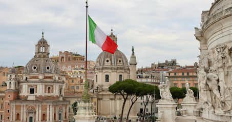 View of an Italian flag over the city of Rome.