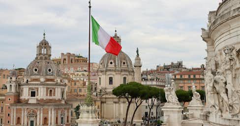 View of an Italian flag over the city of Rome.