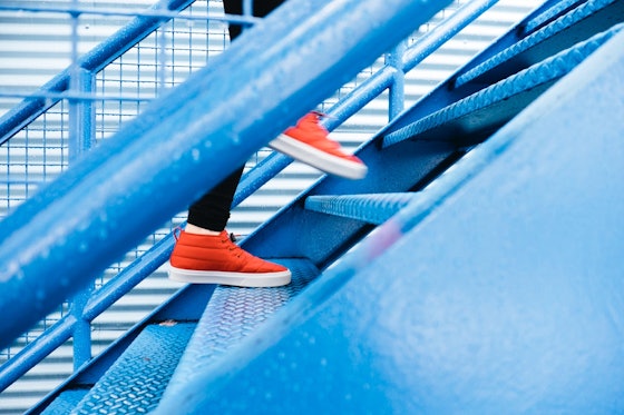 Person walking up stairs.