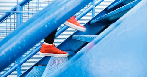 Person walking up stairs.