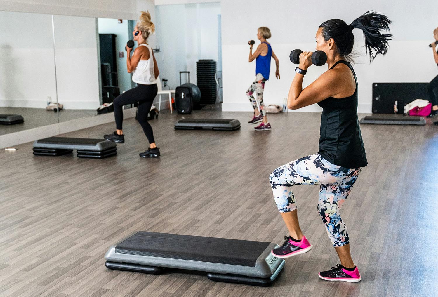 Members in a cardio sculpt class at the gym