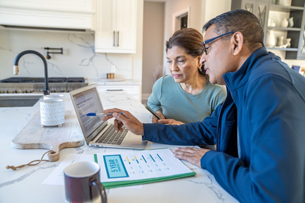 Couples finances with laptop