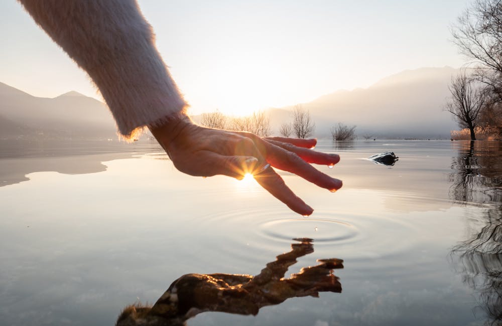 hand touching water refreshness