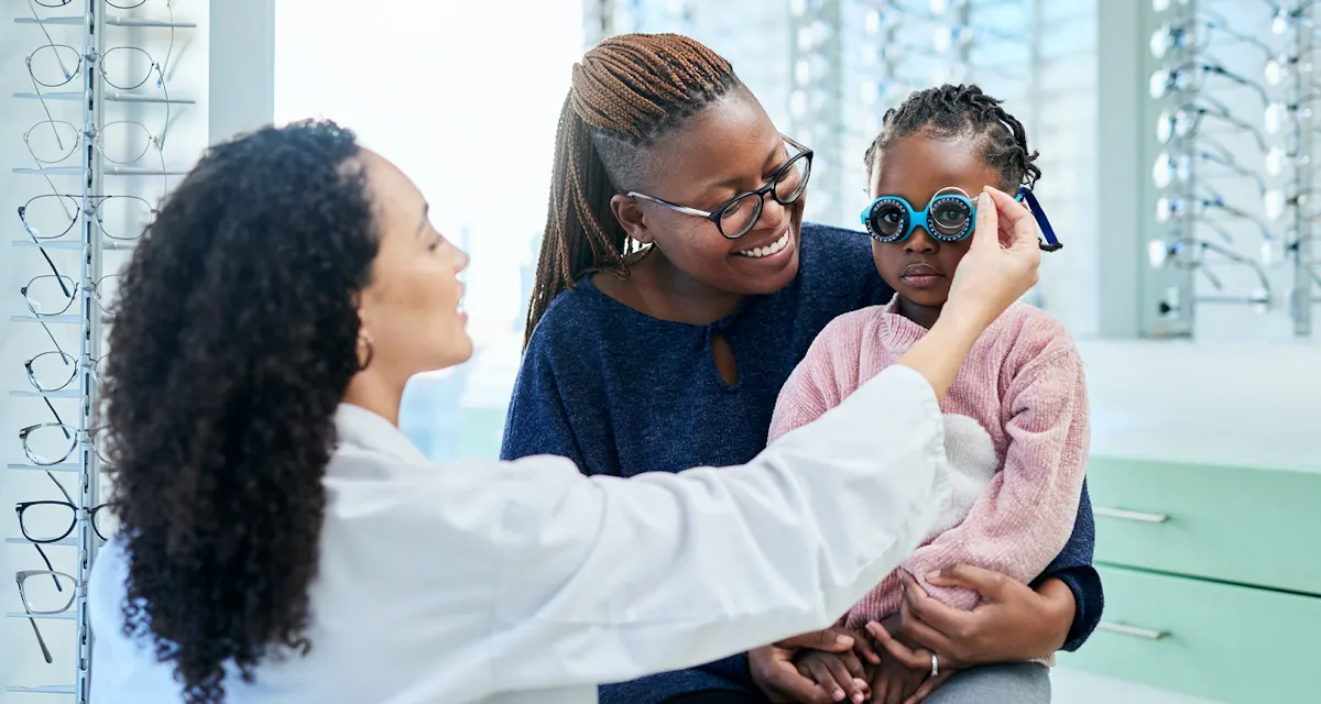 mother with child at optometrist for eye test