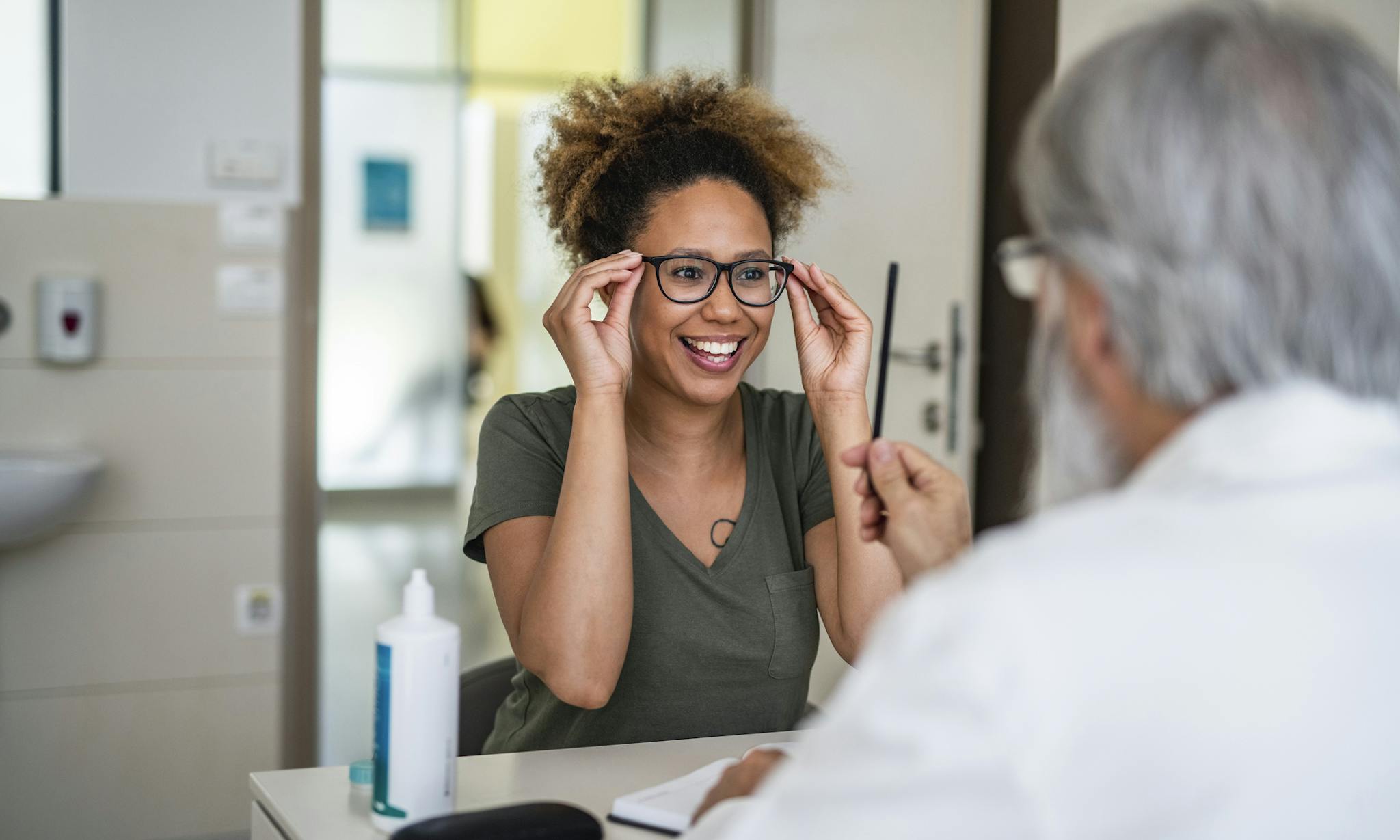 Young Woman Trying on Eyeglasses