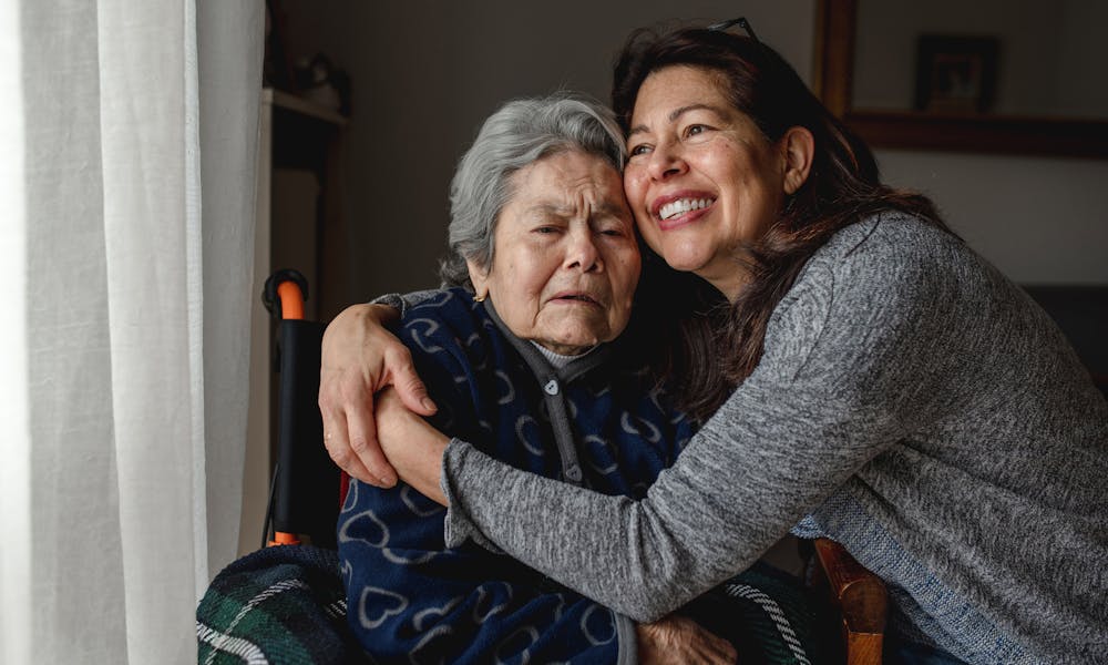 Elderly Woman and Daughter Hugging