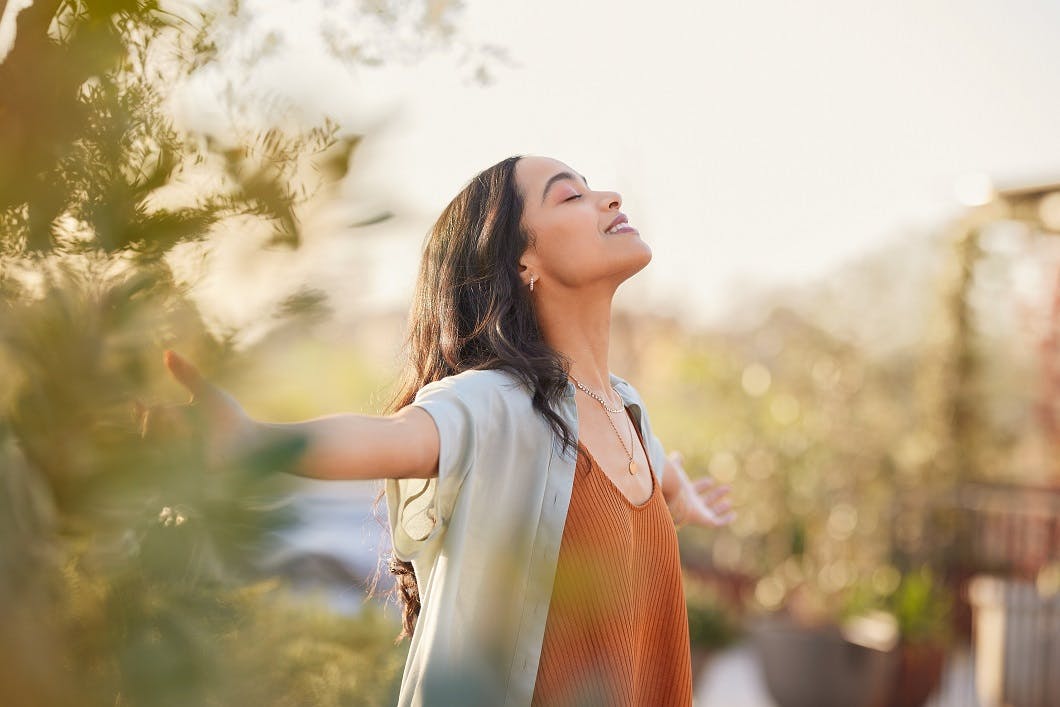 latin woman enjoy sunset with gratitude