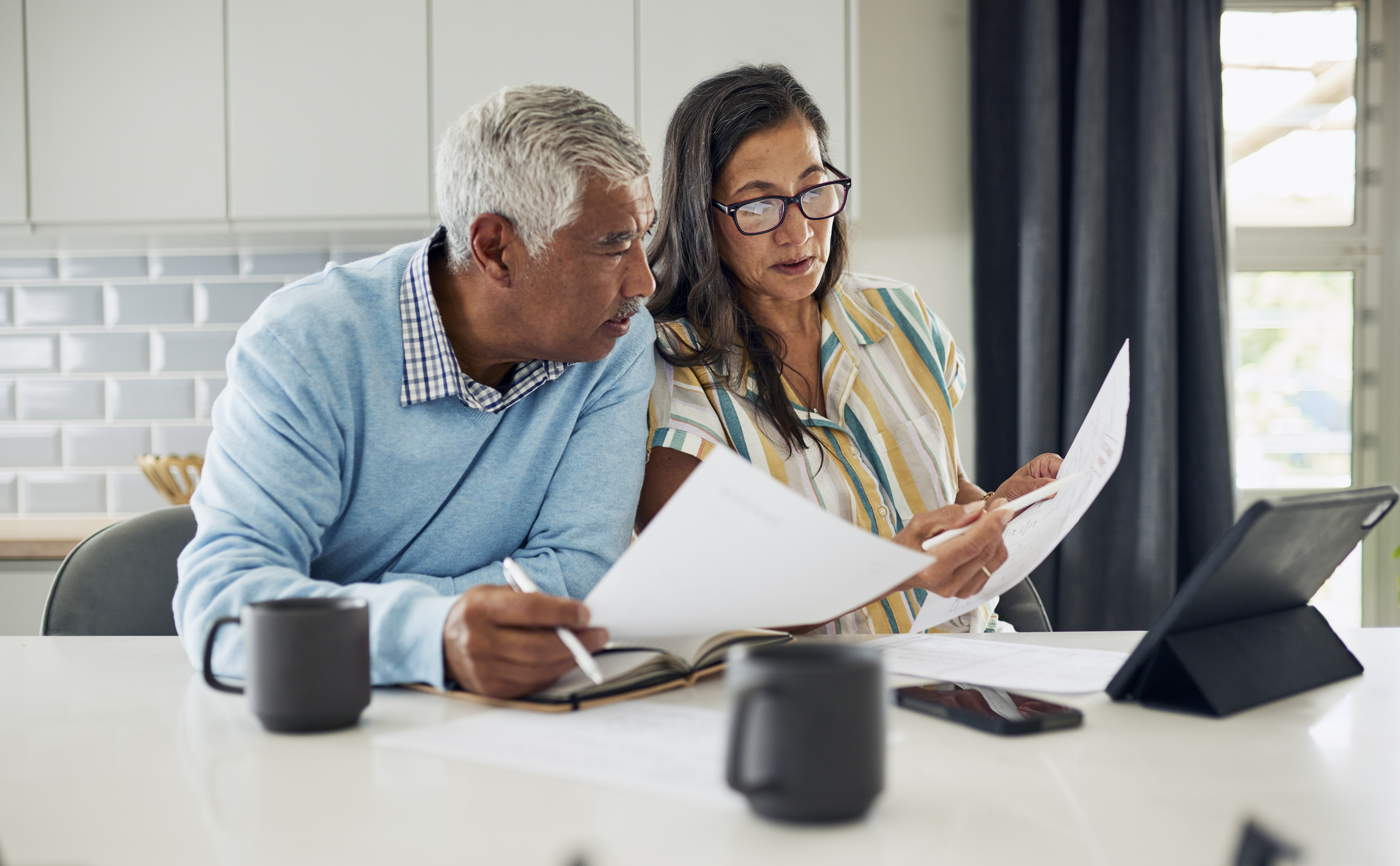 mature couple reviewing documents