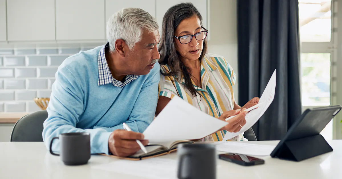 mature couple reviewing documents
