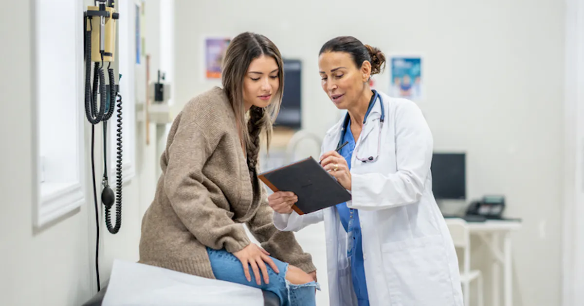 doctor-and-patient-looking-over-charts