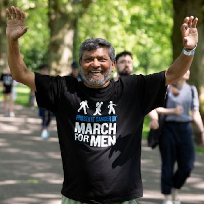 Man smiling wearing Prostate Cancer UK t-shirt