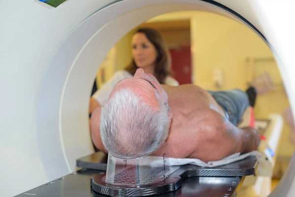 Photo of a man laying down in a scanner.