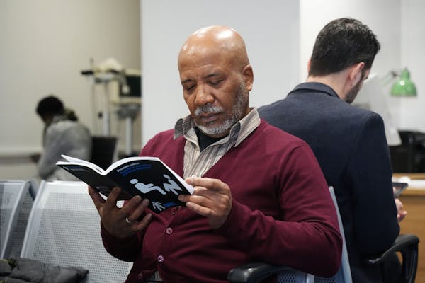 Photo of a man reading a prostate cancer guide