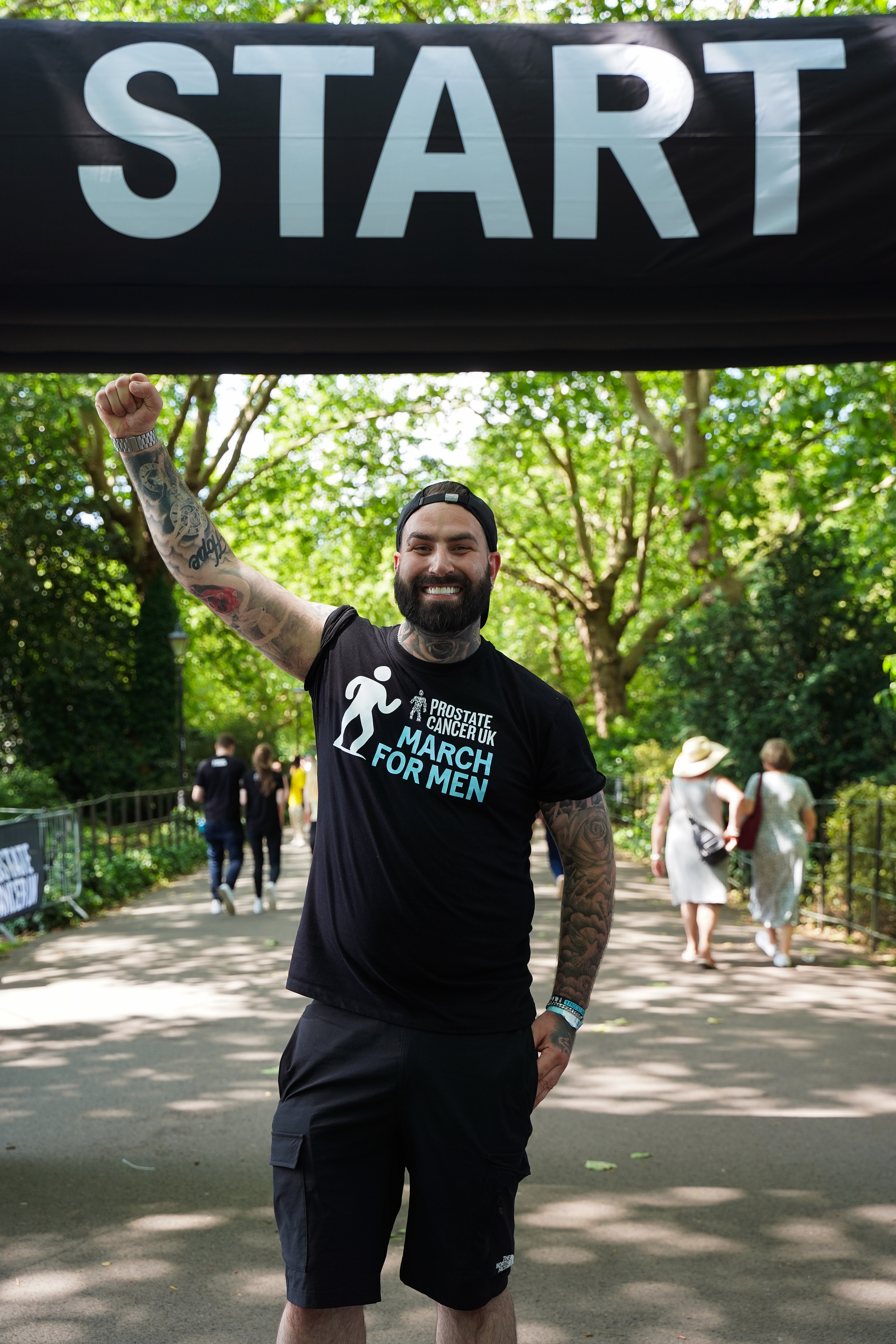 Man smiling wearing Prostate Cancer UK t-shirt