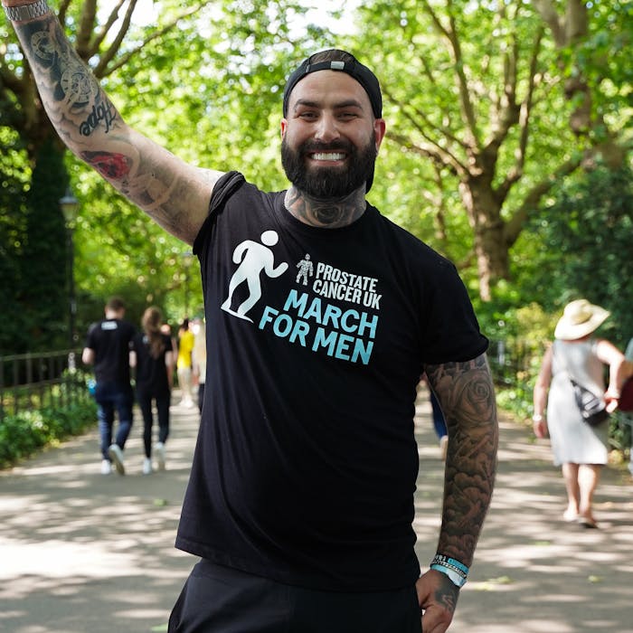 Man smiling wearing Prostate Cancer UK t-shirt