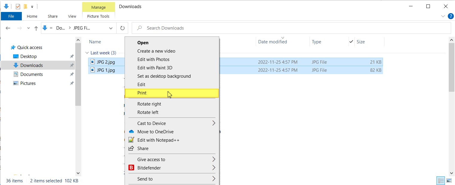 File explorer dialog box. Two JPG files are selected. The right-click context menu is open, the "Print" option is highlighted. 