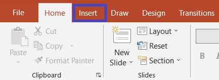 Insert tab in PowerPoint with a blue box around it. 