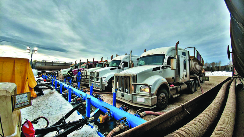 Group of Peaceland trucks supporting a frac operation