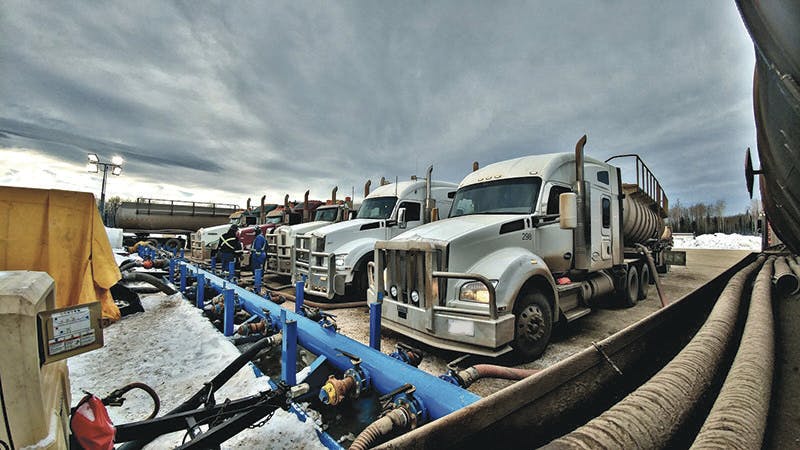 Group of Peaceland trucks supporting a frac operation