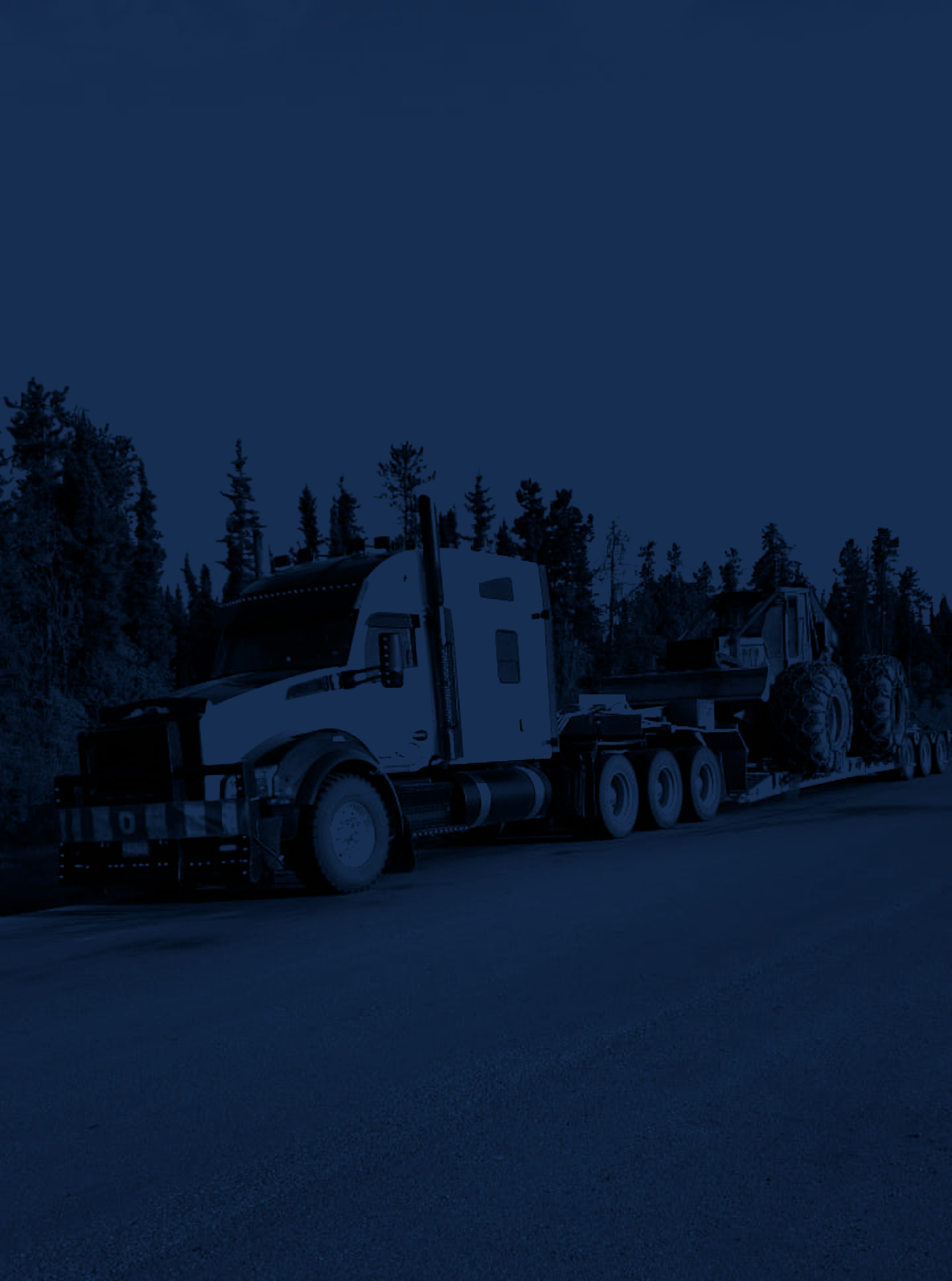 Peaceland truck hauling logging equipment