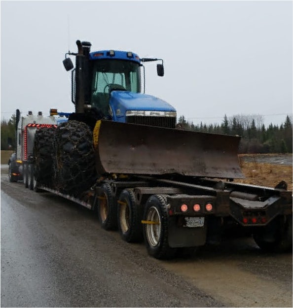 Peaceland truck moving New Holland tow tractor