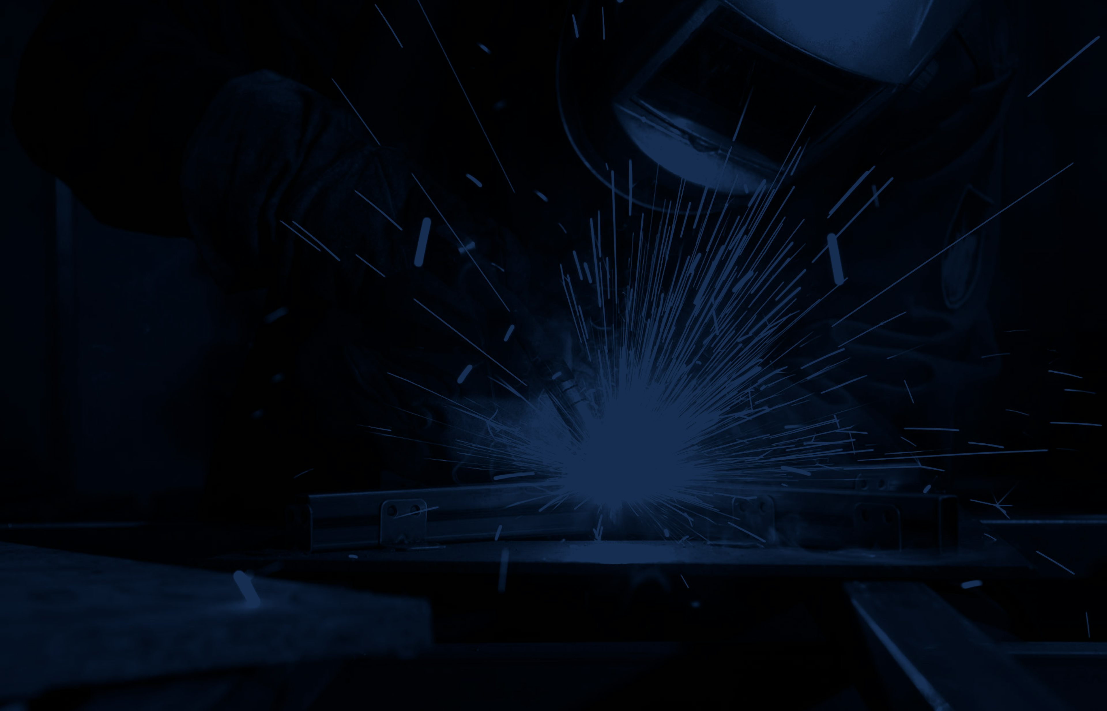 Peaceland welder fabricating a mount for an oilfield facility