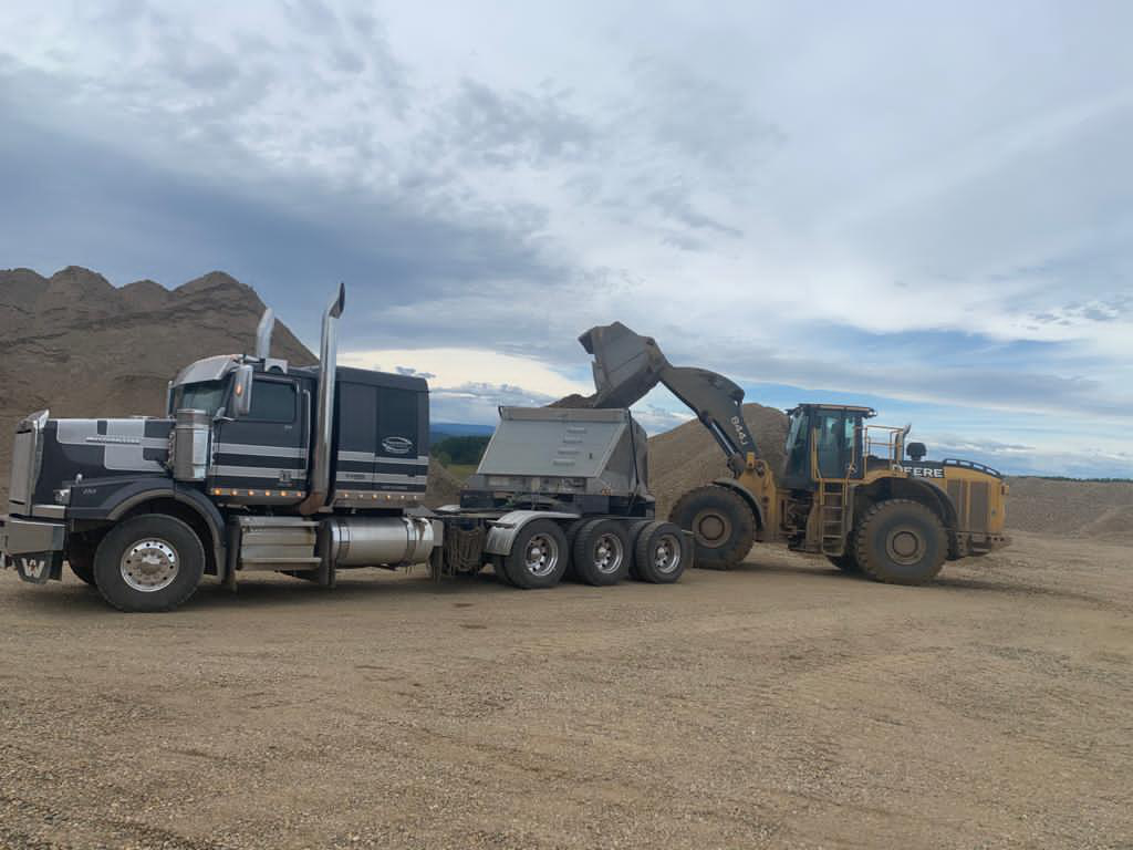 Peaceland gravel truck being loaded with aggregate