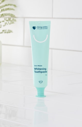 Marketing image of 1 x Pearlii Zero-Waste Whitening Toothpaste, sitting on a bathroom benchtop